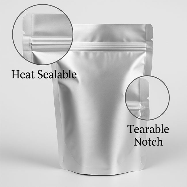 Silver Mylar stand-up pouch showing heat-sealable top and tear notch for easy opening – Buy at VacuumSealBags.co.nz